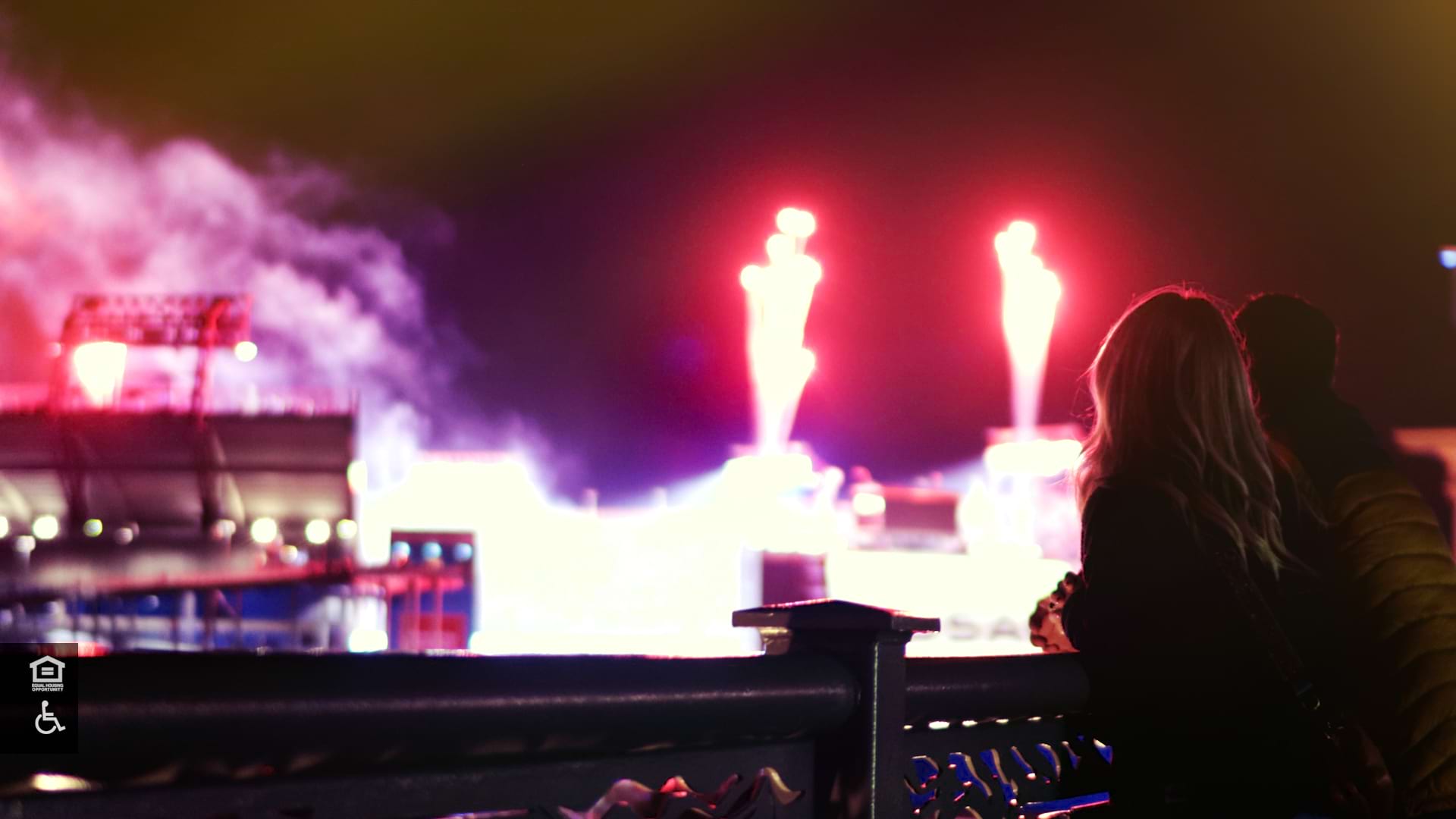 Couple look out at Fireworks at football stadium in Nashville, Tennessee