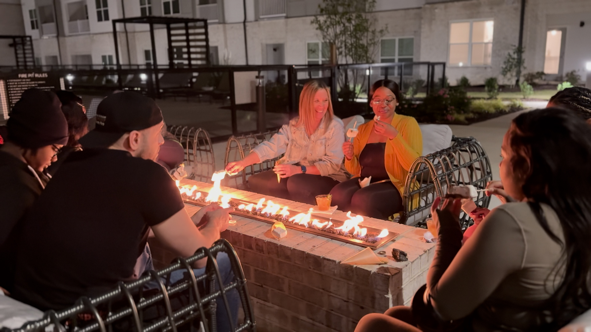 A group of residents sit around the fire pit at The Ravelle apartment community in the Southeast Nashville neighborhood of Antioch, TN A group of residents sit around the fire pit at The Ravelle apartment community in the Southeast Nashville neighborhood of Antioch, TN