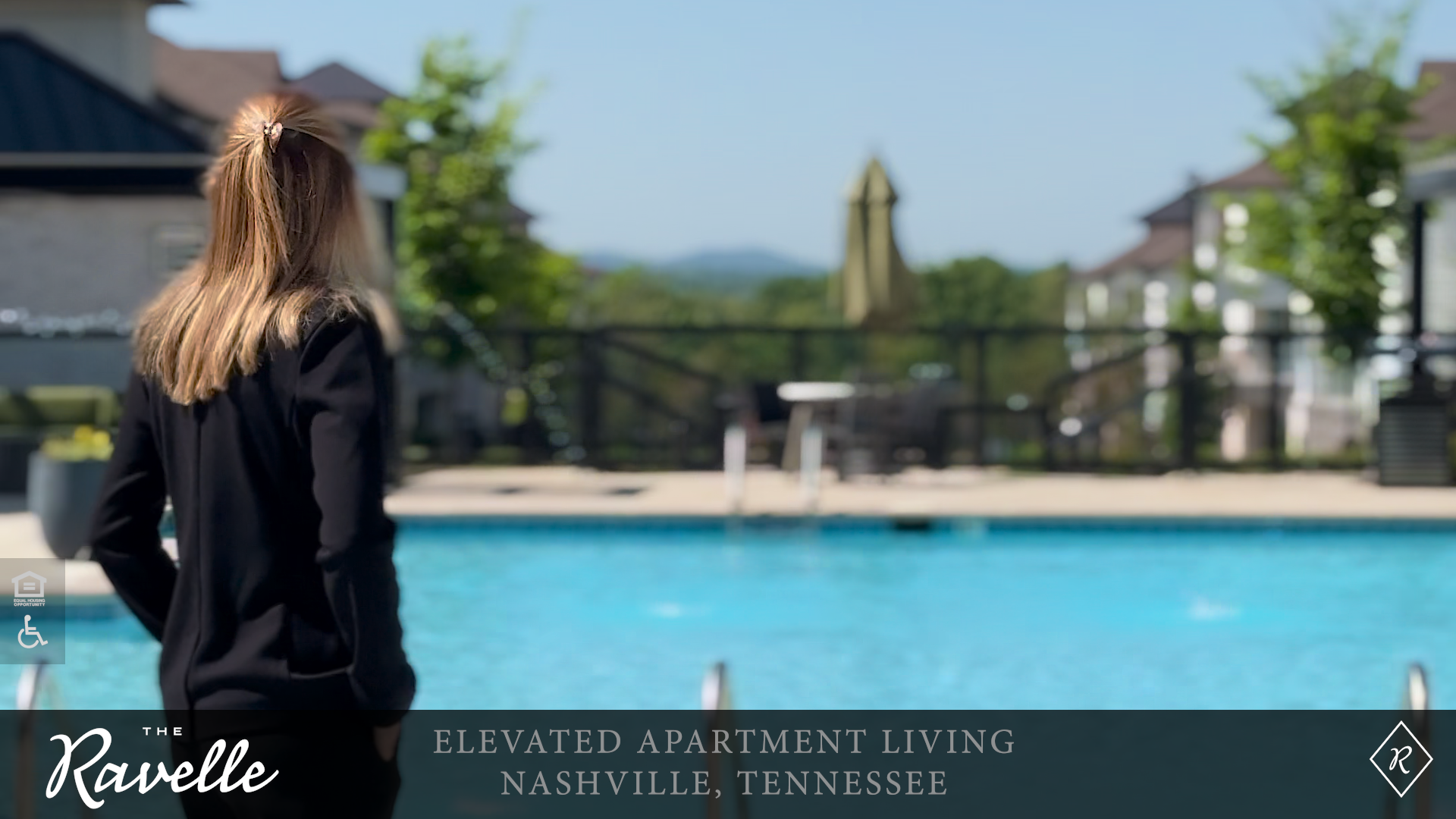Resident looks out over the salt-water pool, the grand courtyard, and the distant Tennessee hills at the Ravelle apartment community in Antioch, TN. Resident looks out over the salt-water pool, the grand courtyard, and the distant Tennessee hills at the Ravelle apartment community in Antioch, TN.