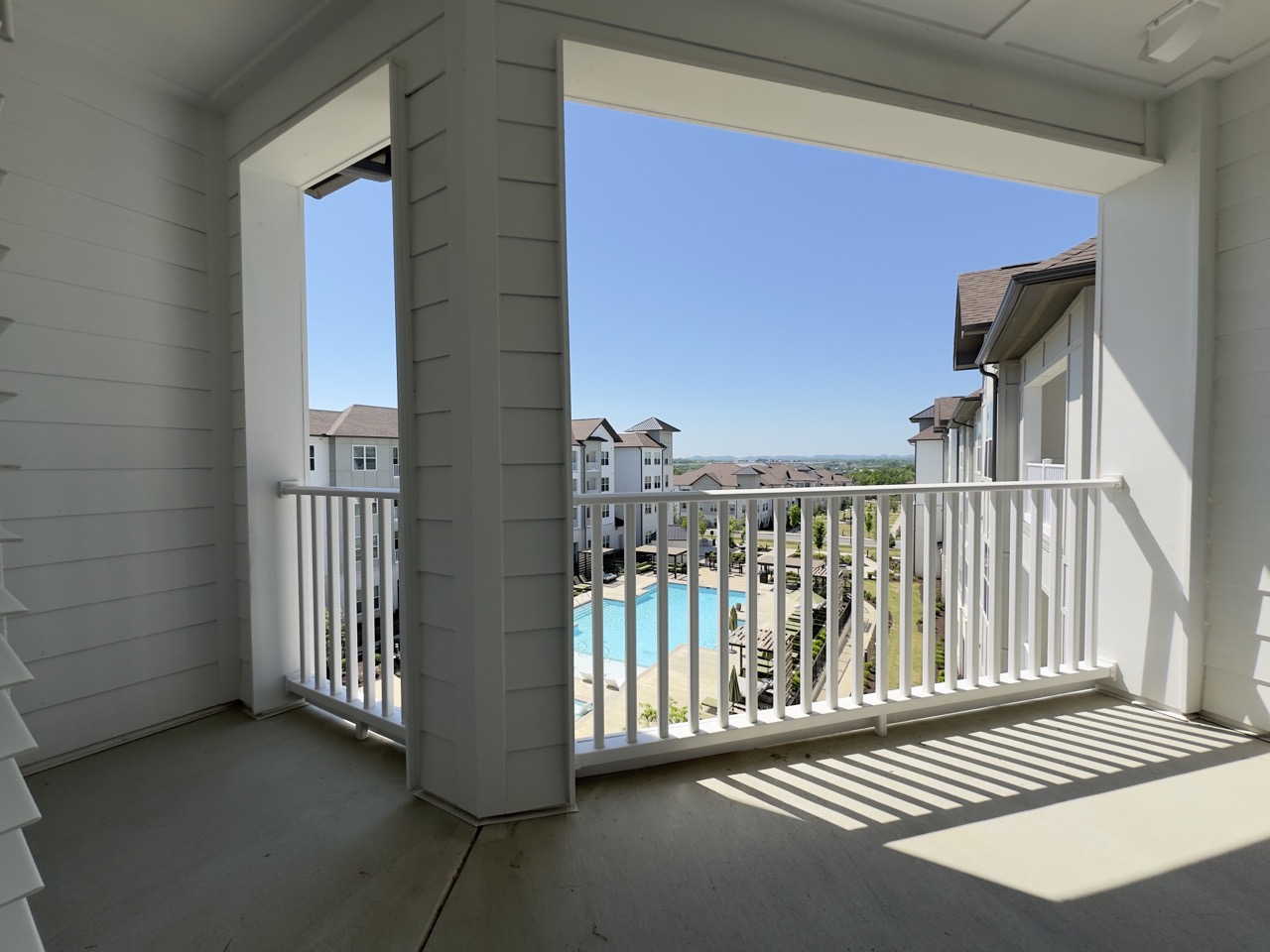 Balcony view from 4th Floor Horizon Floor Plan, looking over the salt water pool and grand courtyard