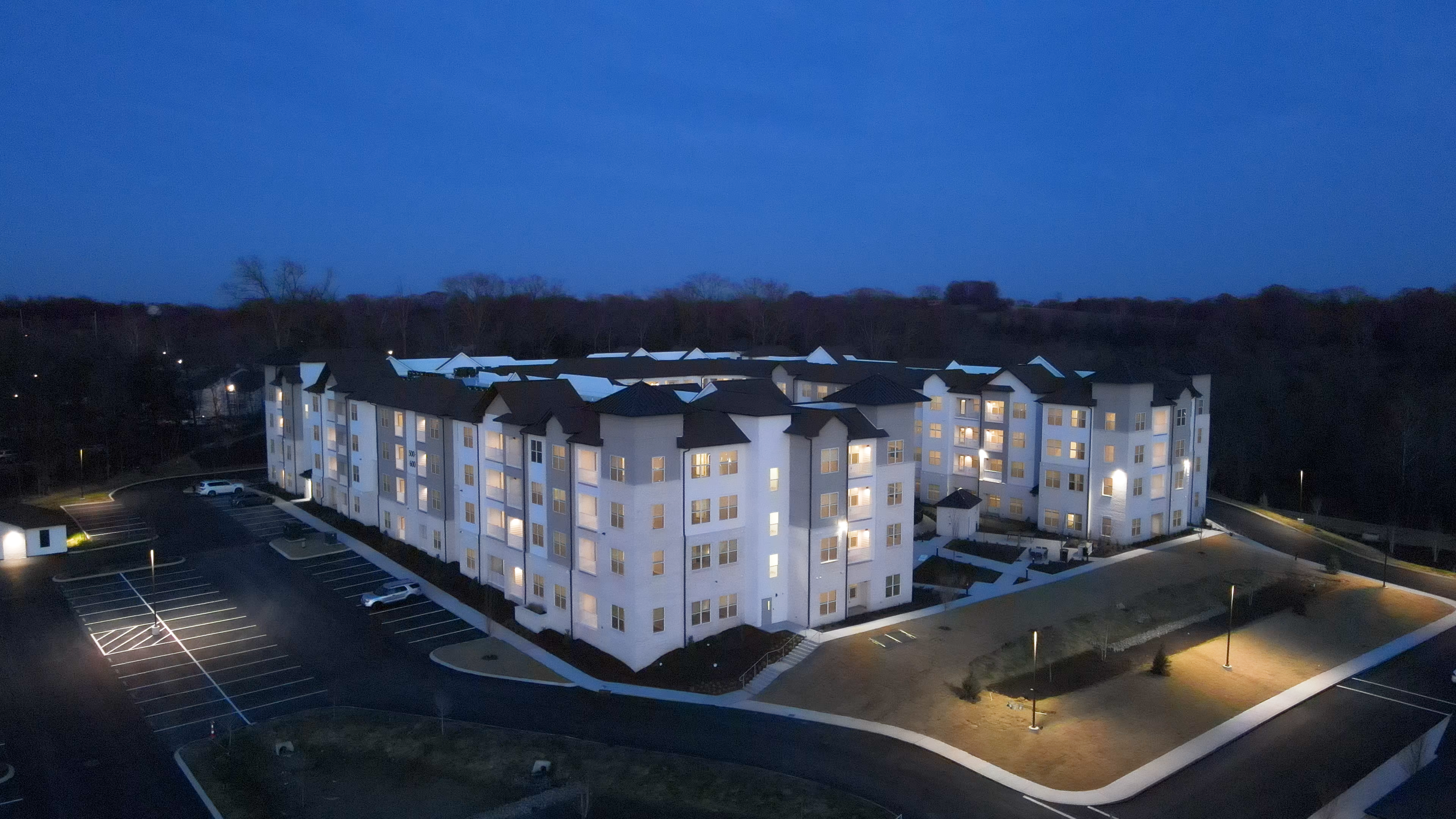 Evening aerial view of the signature, three story high rise building at the Ravelle at Ridgeview. Evening aerial view of the signature, three story high rise building at the Ravelle at Ridgeview.
