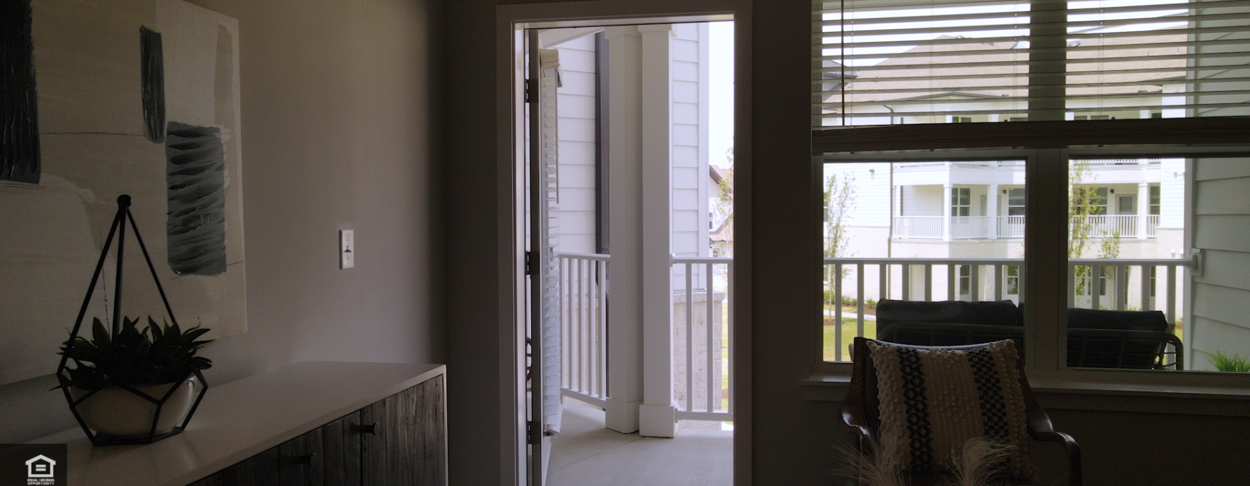 Living area of 1B/1B Horizon Floor Plan, looking out at balcony