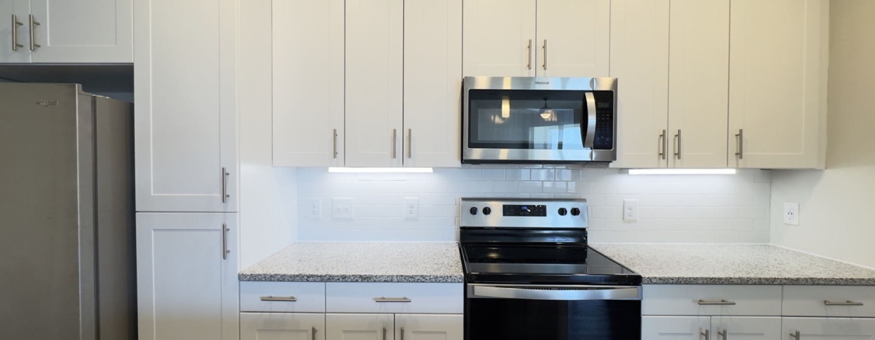 White Kitchen Cabinets in Horizon Floor Plan at The Ravelle