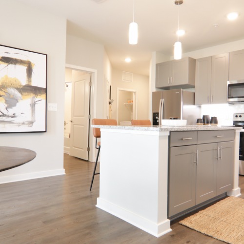 Luxurious kitchen with gray cabinetry at The Ravelle at Ridgeview apartments in Antioch, TN.
