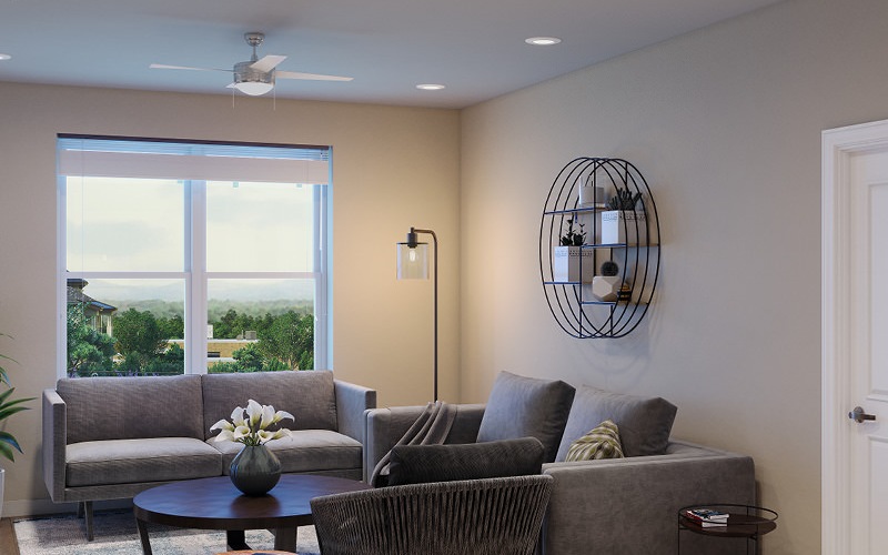 ceiling fan and light fixture in living room with windows