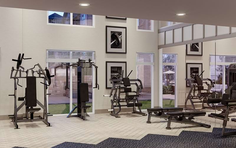 two-story fitness center with high ceilings and ample lighting
